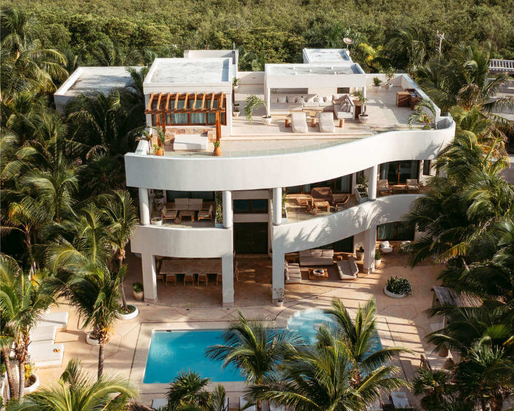 Aerial view of the villa, the pool and the jungle around it